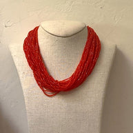 ORANGE GLASS PEARL NECKLACE.