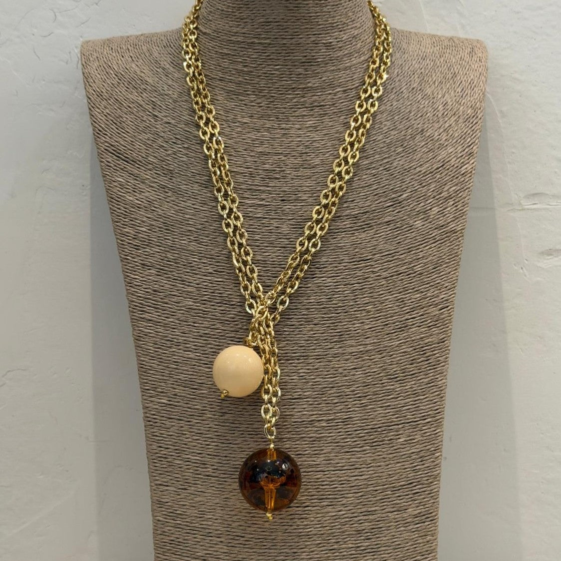 COLLAR SPHERA TRANSPARENTE BOLAS MARFIL Y AMBAR