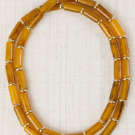 COLLAR LARGO TUBULAR RESINA MOSTAZA